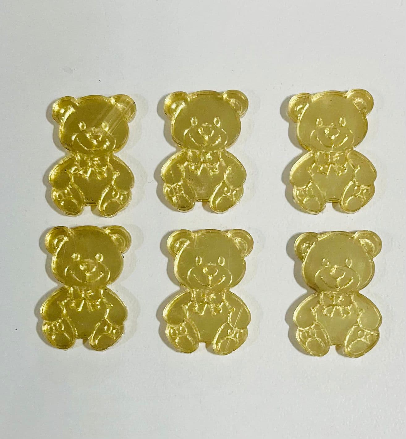 Aplique de ursinho em acrílico dourado 2cm (unidade)